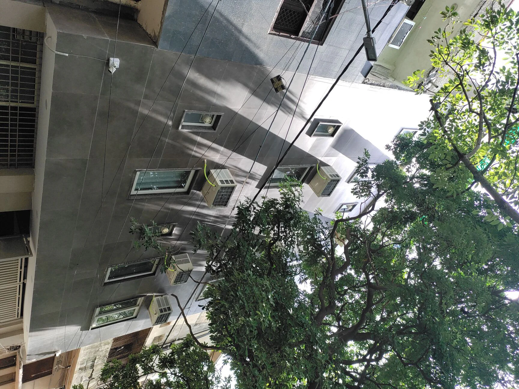 Happy Living hostel building exterior in Roop Nagar, Delhi