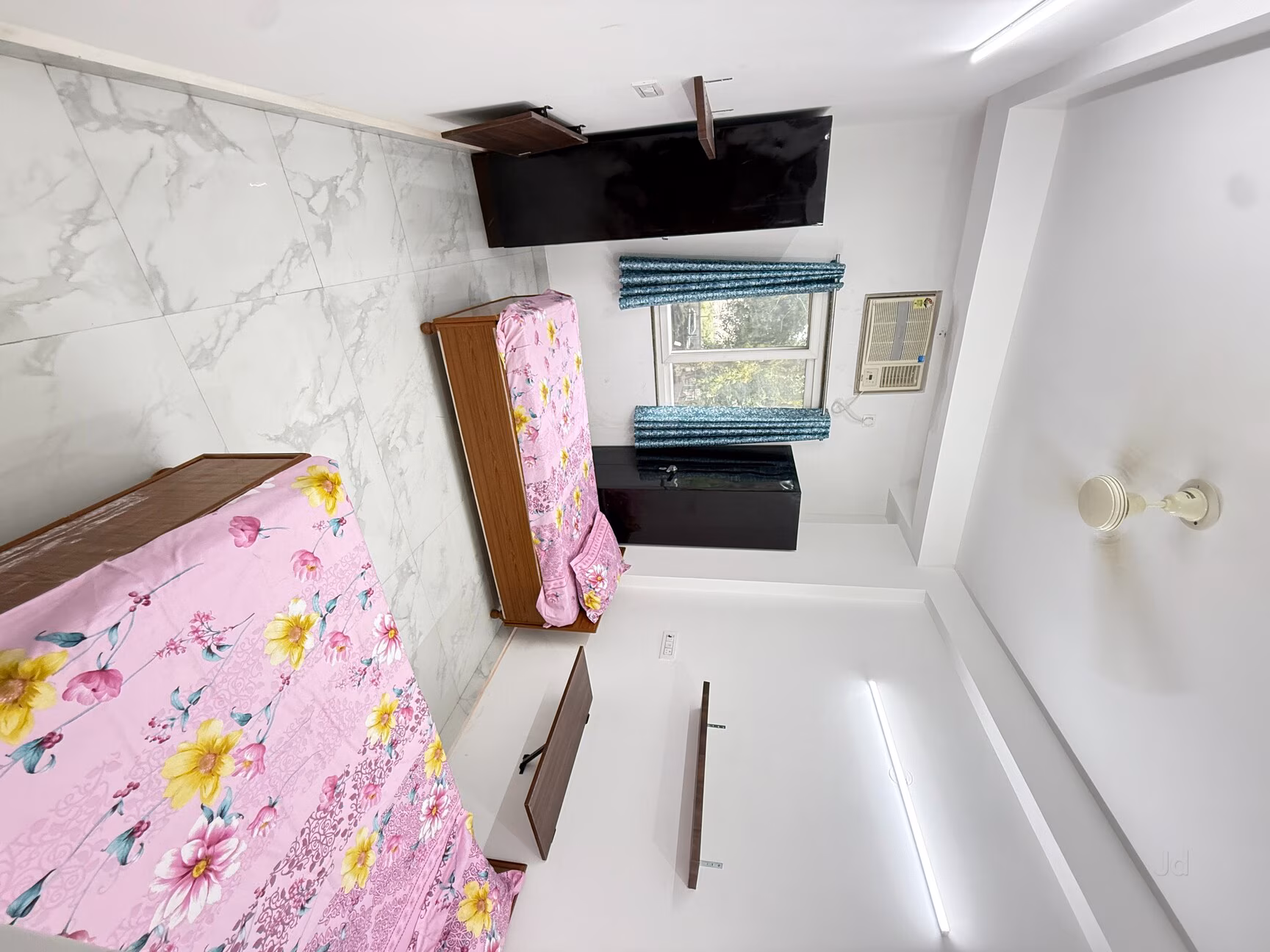 Furnished room with wardrobe and study space