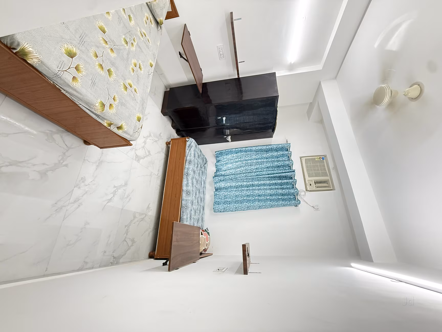 Well-lit room with study desk and storage