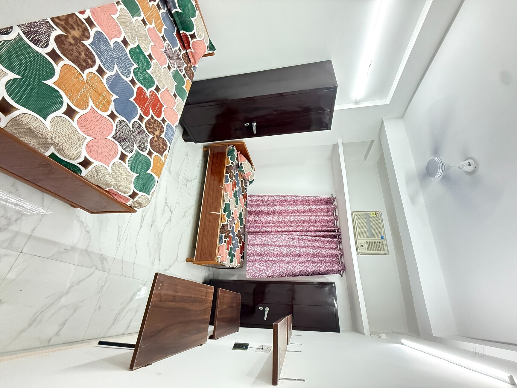 Spacious twin sharing room with marble flooring
