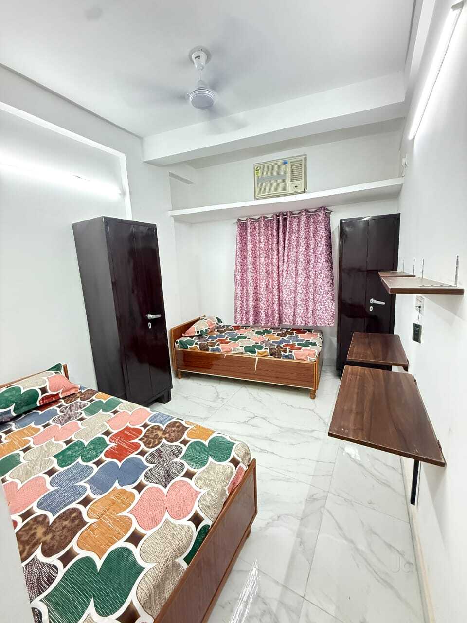 Twin sharing bedroom with wardrobes and AC